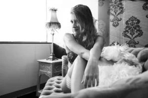 Dramatic indoor studio boudoir portrait with moody lighting in Houston TX