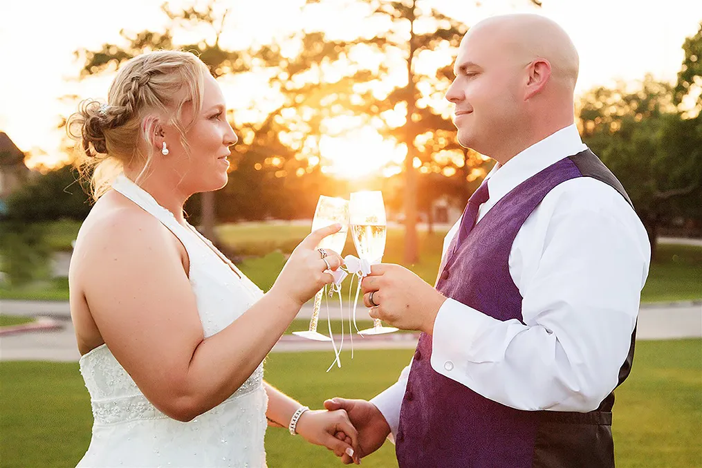 Groom blindfolded holding hands with bride before their South Shore Harbour Country Club wedding